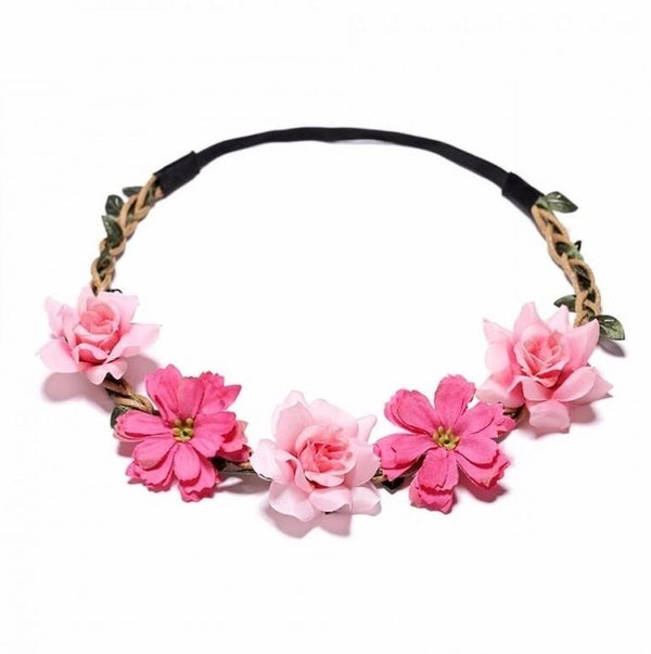 Bohemian style gevlochten haarbandje met blaadjes en diverse roze bloemetjes