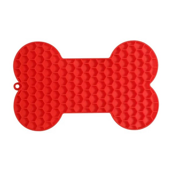 Likmat voor de hond in de vorm van een hondenbot rood