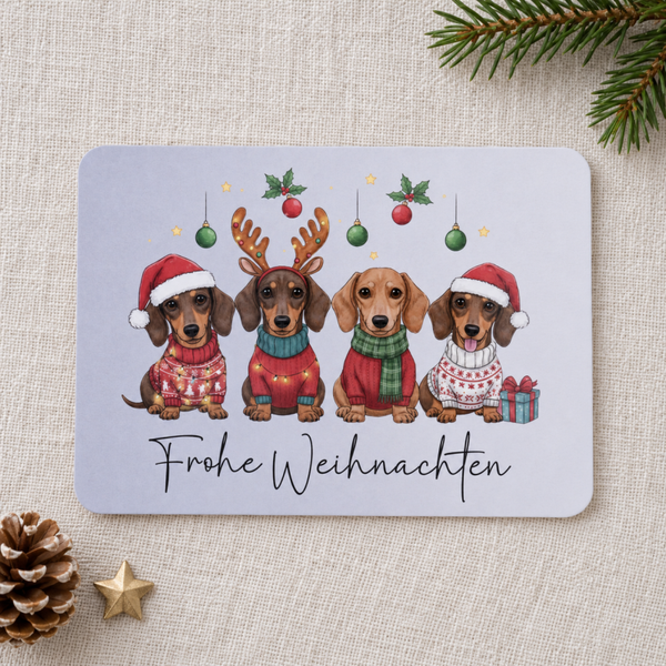 Postkarte Frohe Weihnachten – lustige Weihnachtskarte mit vier Dackeln