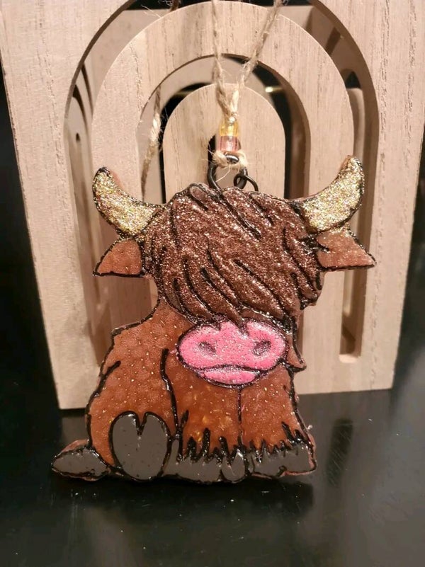 Highland cow sitting