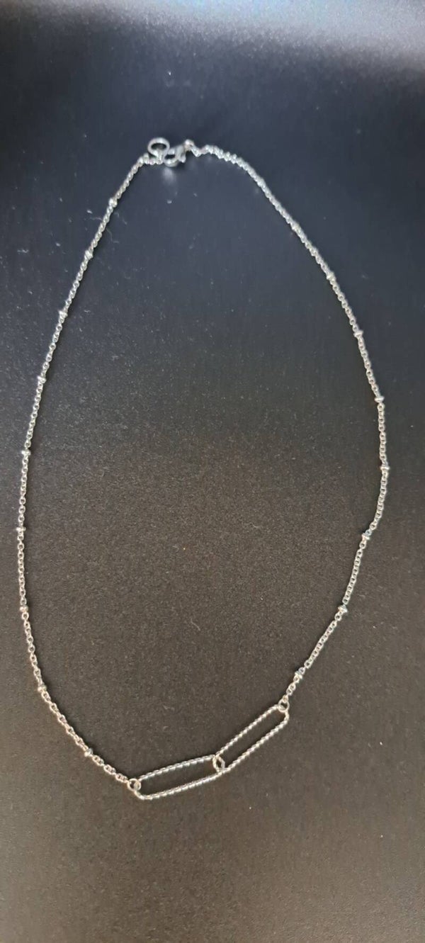 collier argenté trombonne