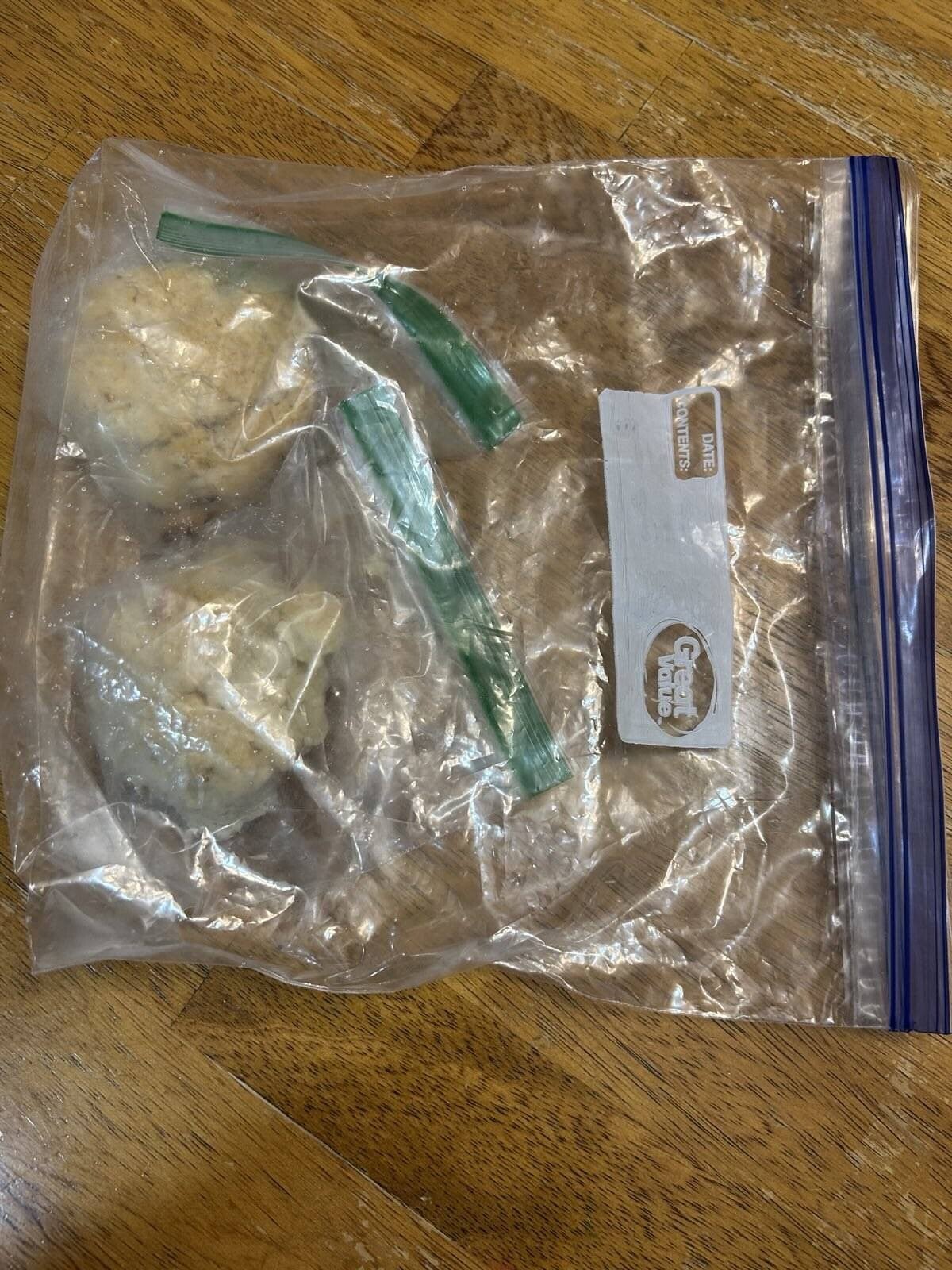 Wrapped biscuits filling  placed a larger freezer bag.