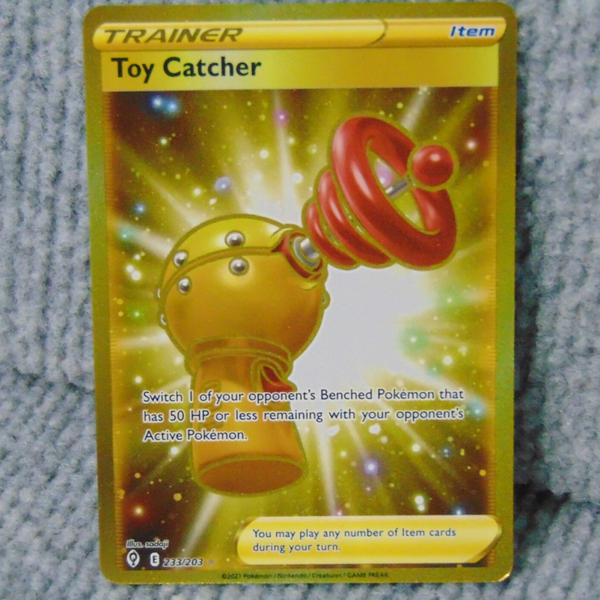 Year 2022 #1233/203 Gold Toy Catcher Trainer card.