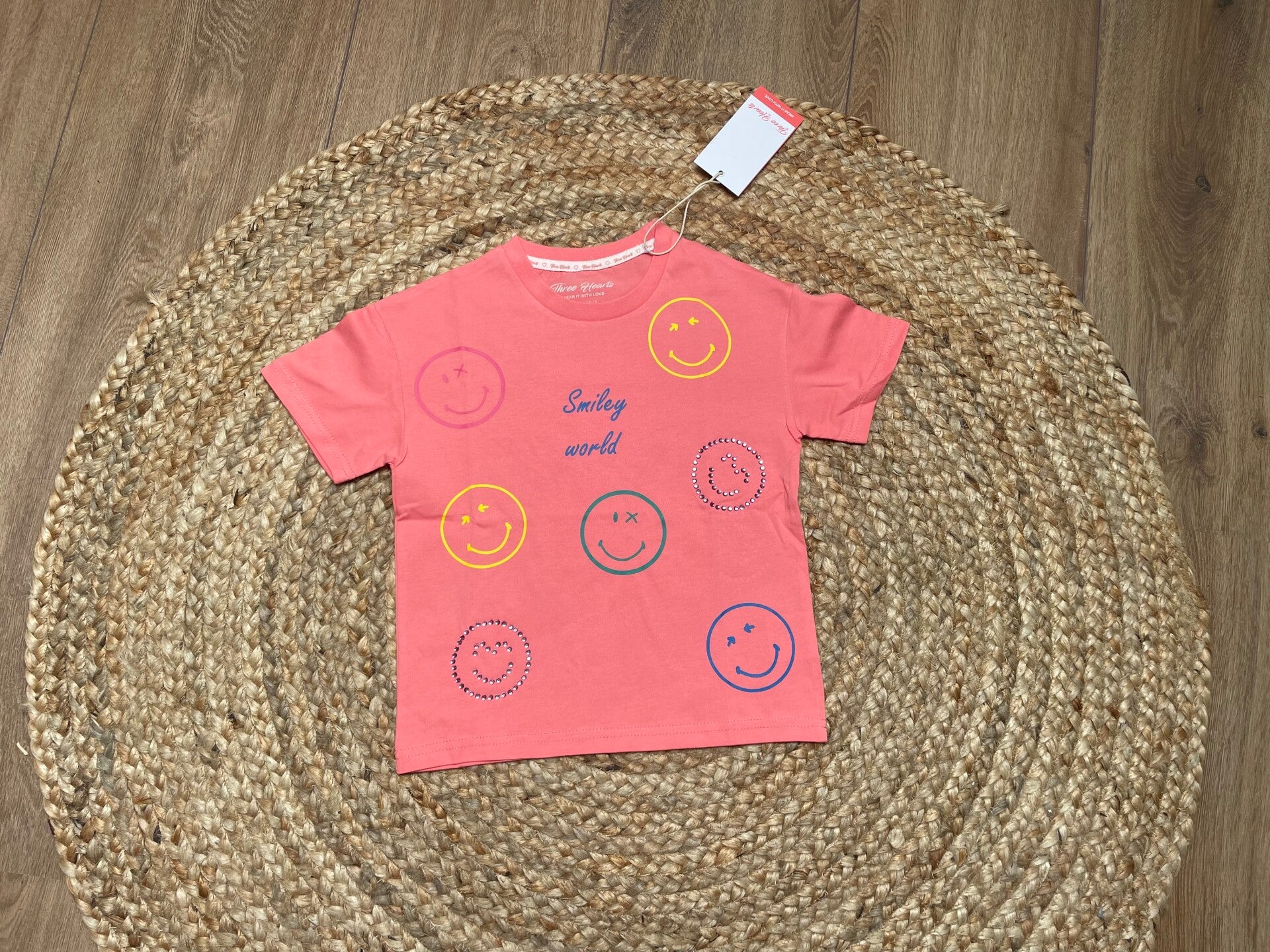 Super leuk shirtje “ smiley” in koraal en blauw