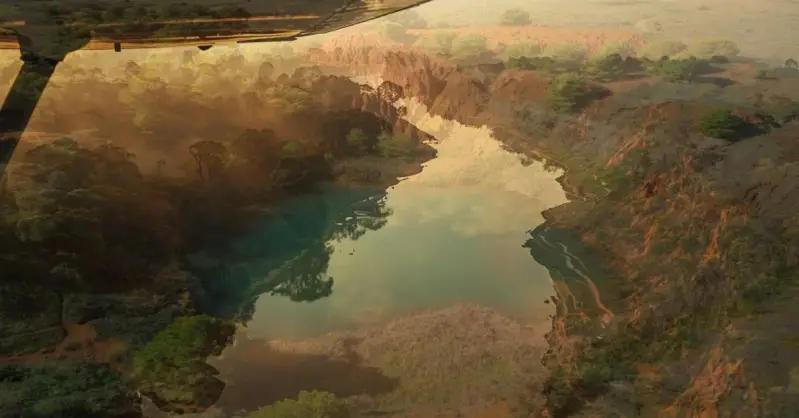 Beneath the aircraft's wing, a river shimmers with reflective clouds.