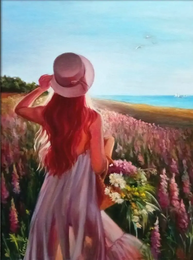 A figurative landscape oil painting viewed from behind a woman with long copper hair and a summer hat walking through a dense field of pink flowers toward a bright blue sea.