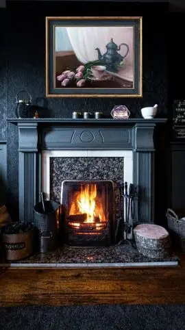 The original still life painting by ElenaG is in a certain interior in charcoal background with a fireplace.
