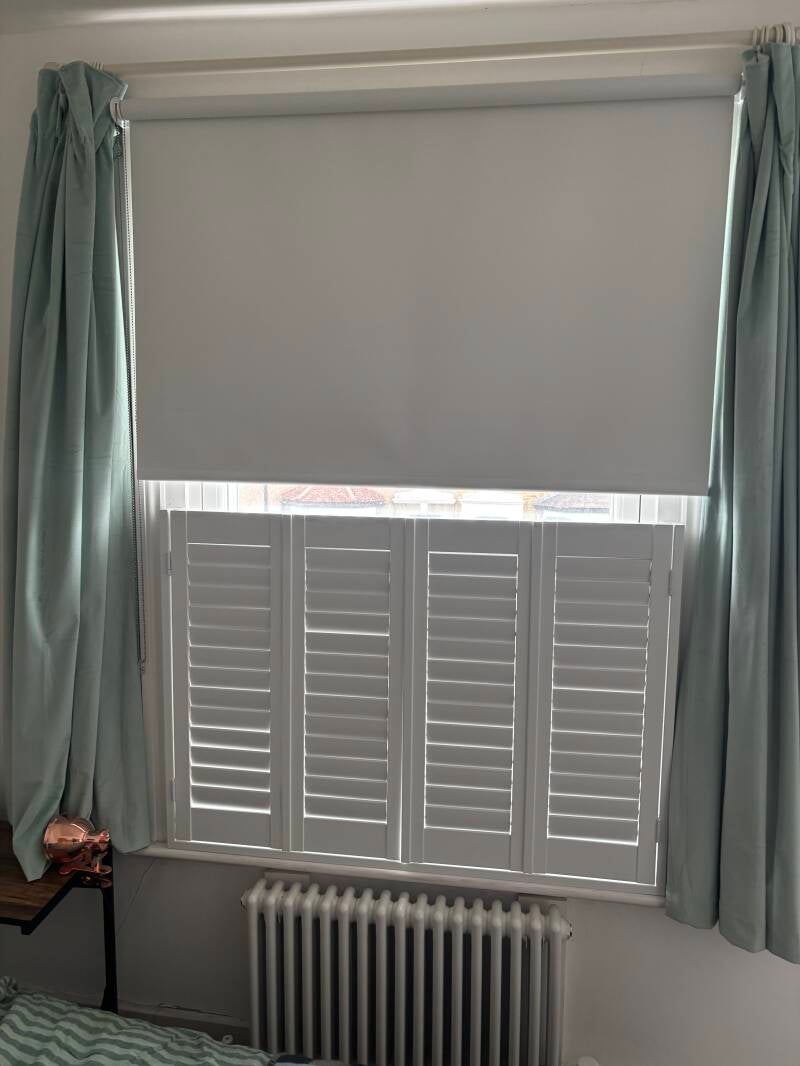 Cafe style shutters fitted with blackout fabric roller blinds in Whitstable 