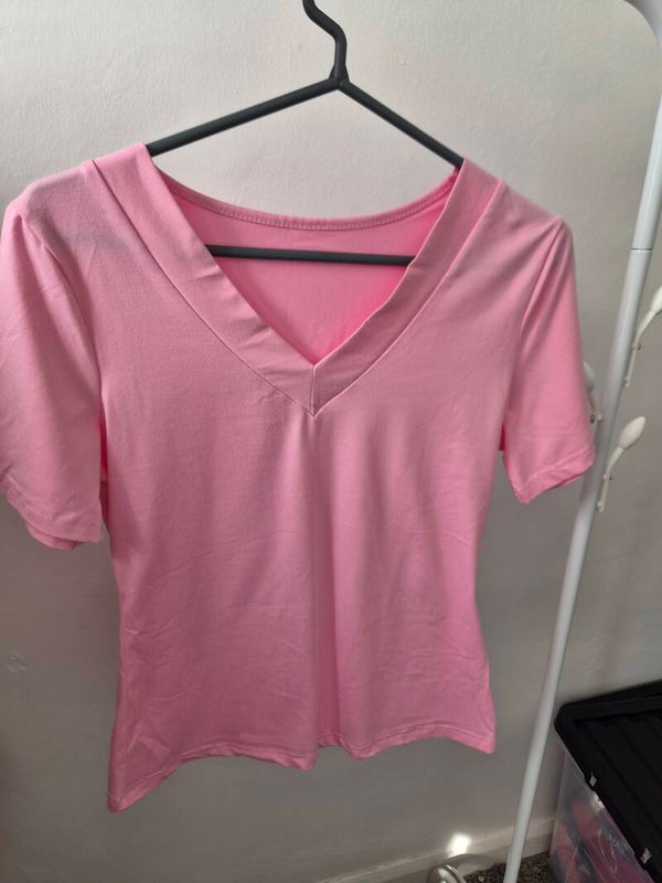 Pink V neck top. Short sleeves. Size Large but comes up smaller