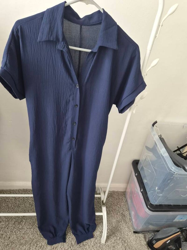 Navy jumpsuit.  No size but measures a medium.