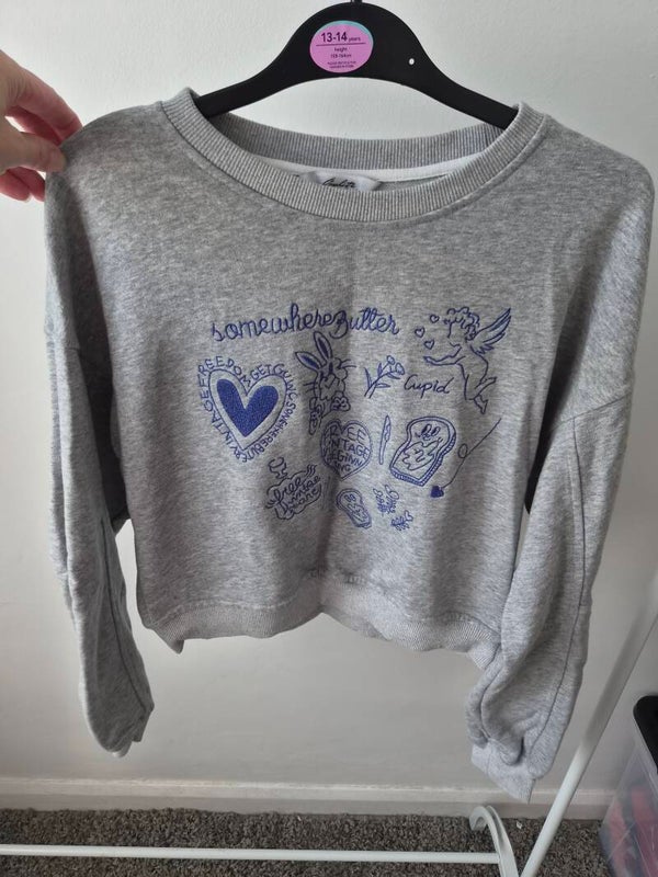Grey short jumper. Size small.