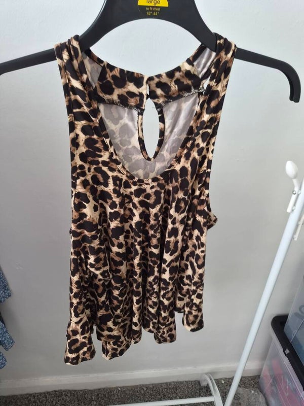 Animal print top. Size large but comes up smaller