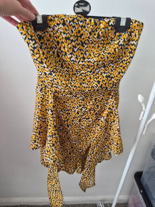 Mustard/navy/white patterned strapless playsuit.  Size medium.but more like a small
