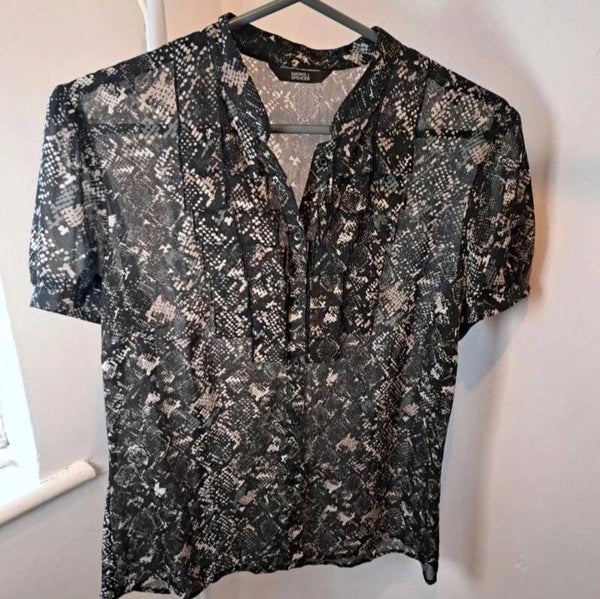 Black/grey patterned see through top. Size 12