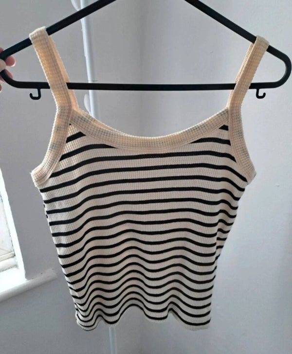 Cream/black vest top. No size but measures an XS.