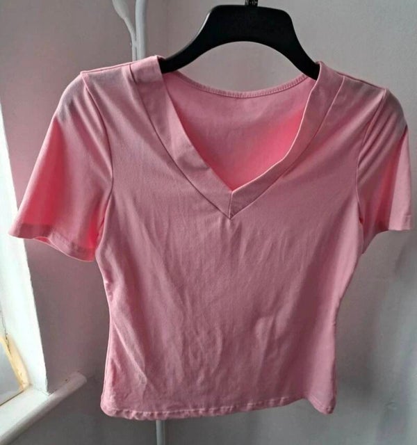 Pink short sleeve top. Size Large but comes up smaller