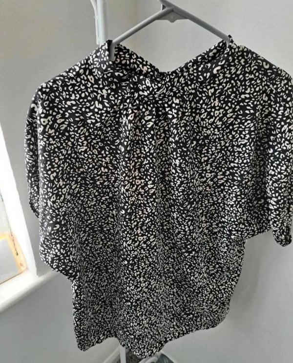 Black/white patterned top. Size medium