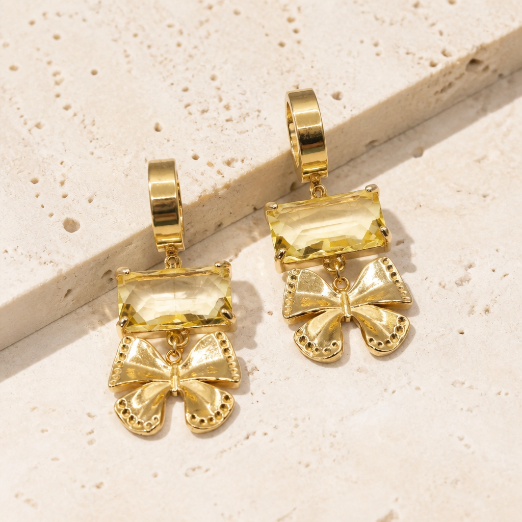 Luce d’Oro oorbellen goud geel Arco strikjes