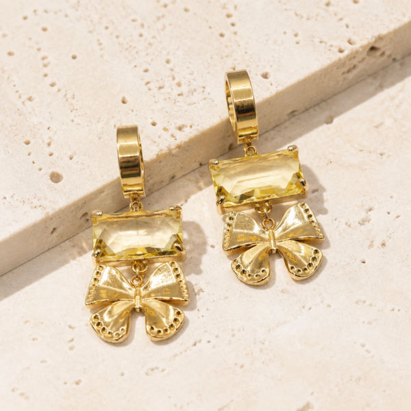 Luce d’Oro oorbellen goud geel Arco strikjes