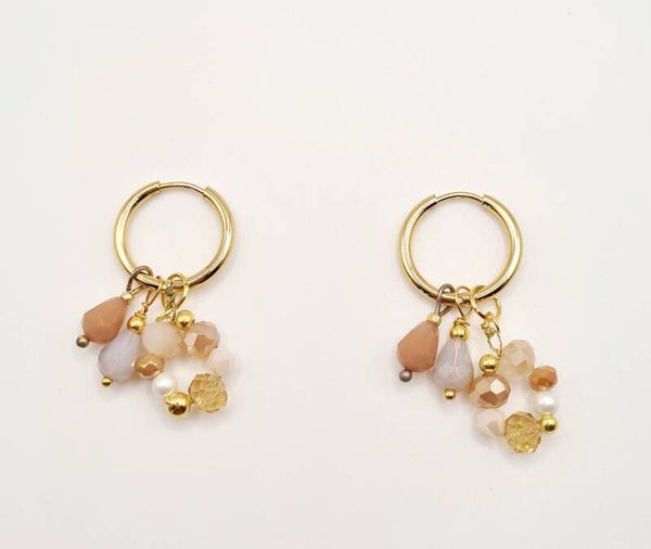 Oorbellen ringen met zacht -en oudroze kleuren