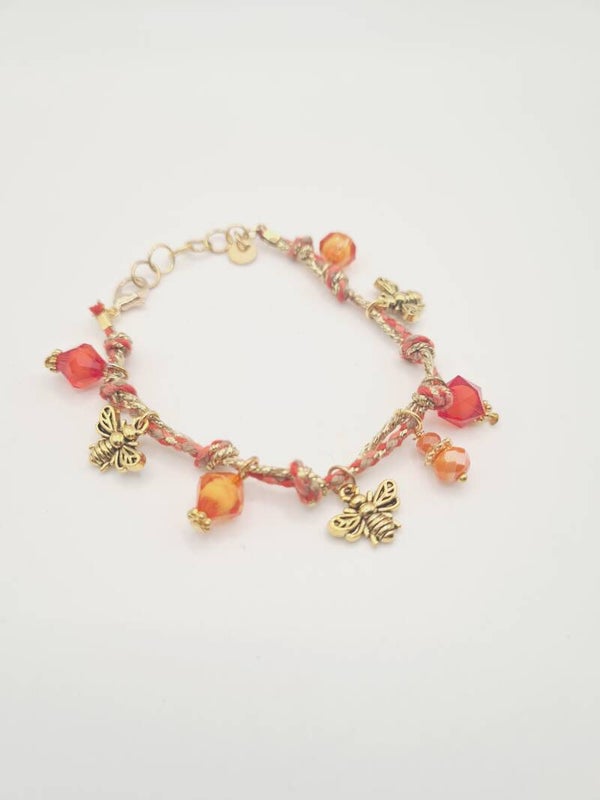 Koord armband oranje met gouden bedeltjes verstelbaar