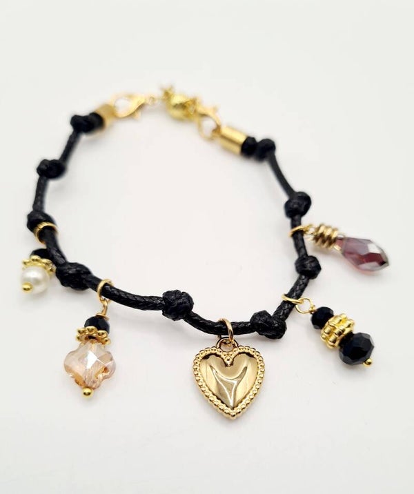 Koord armbanden met gouden bedels en magneetsluiting