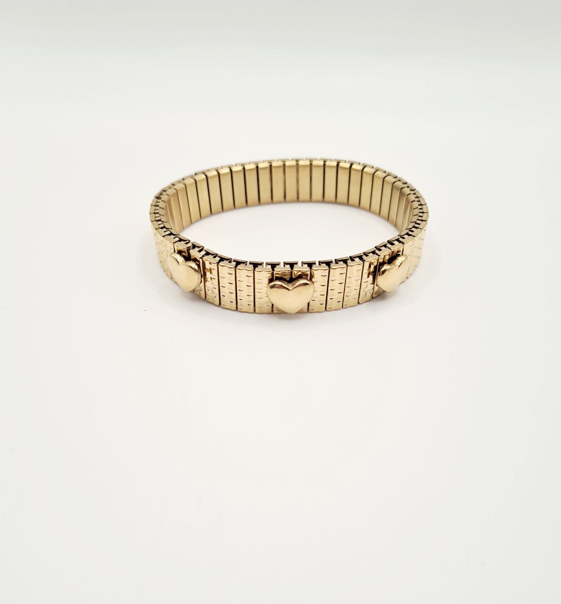 Gouden elastische hartjes armband