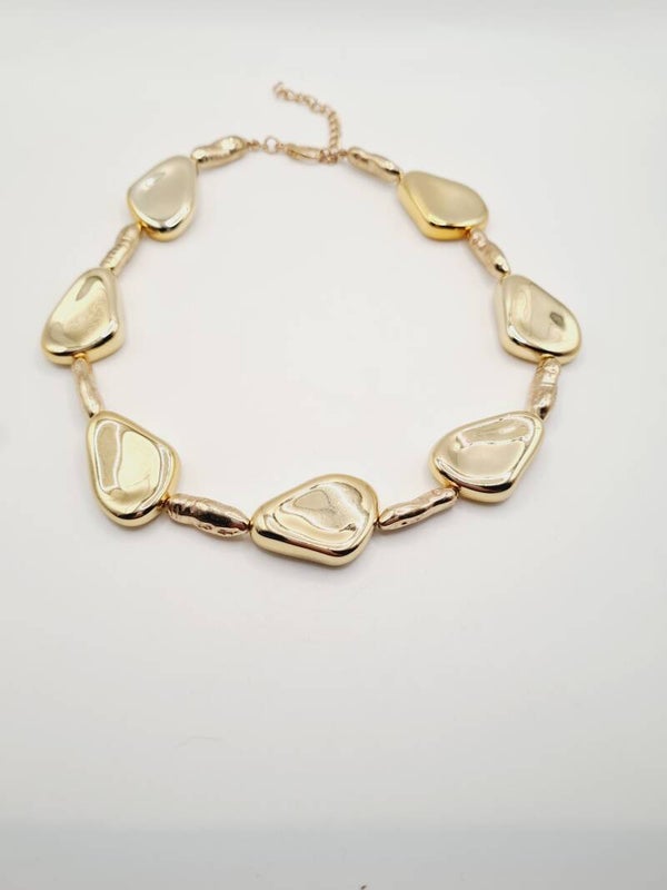 Ketting met gouden acryl kralen