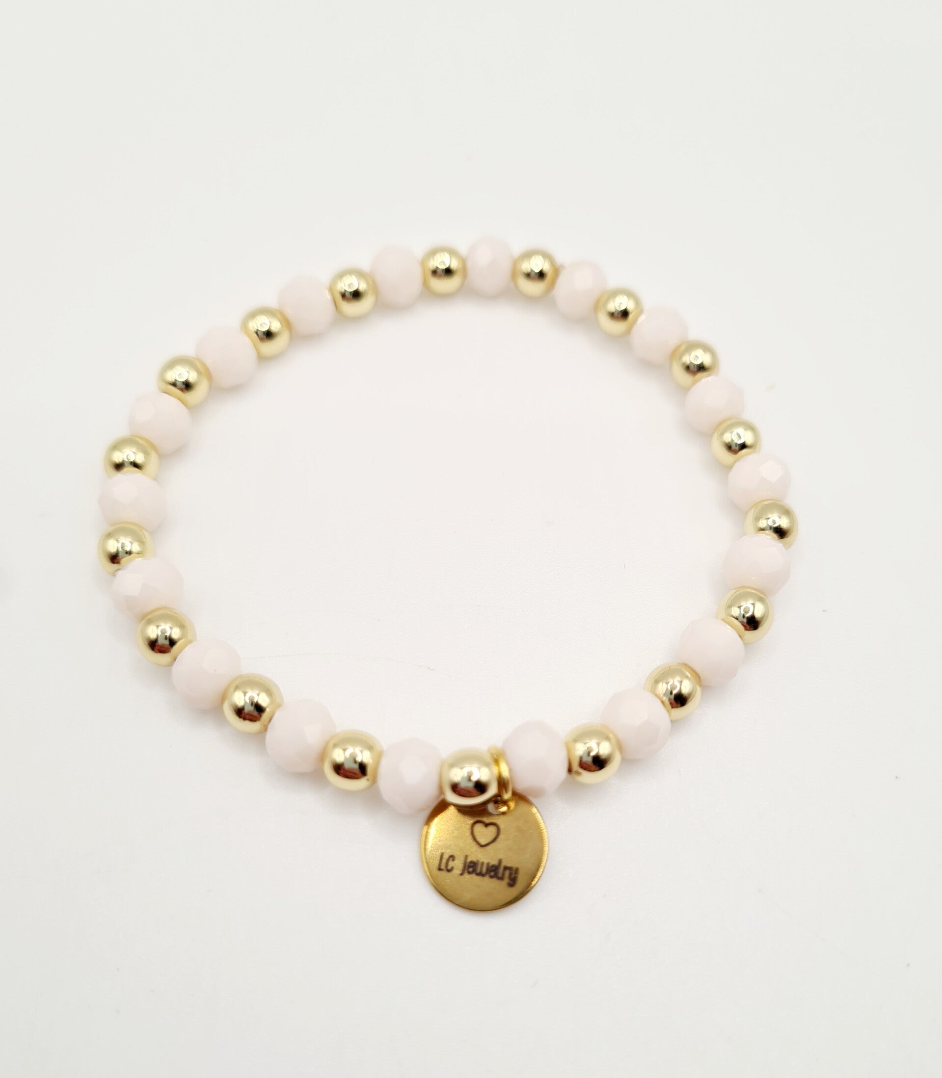 Gold filled armband 18k goud 5mm met zachtroze facetkralen