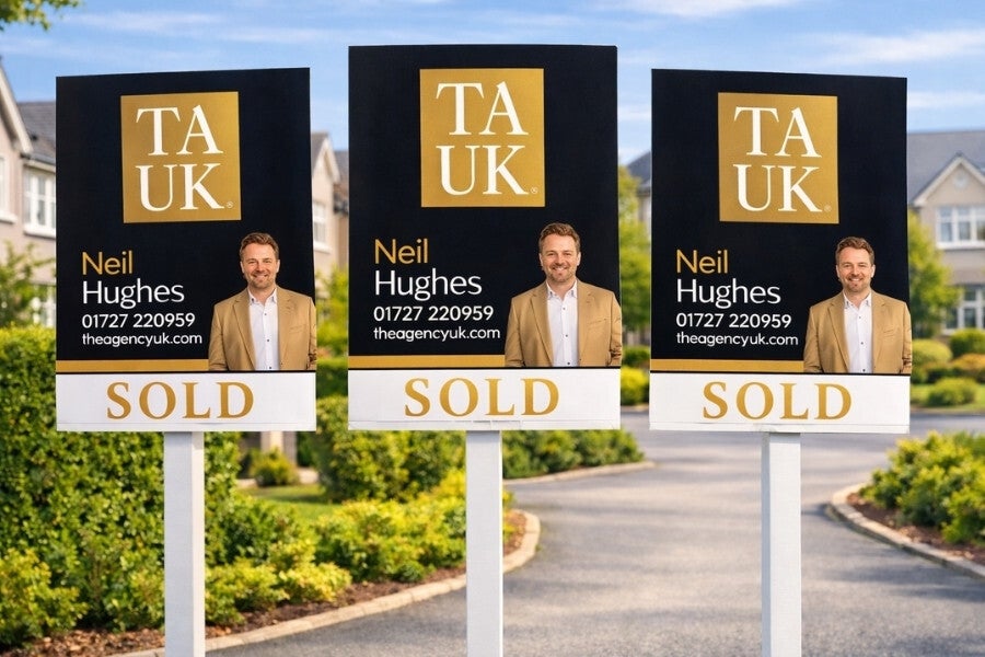 Three TAUK SOLD boards displayed in a premium Park Street, St Albans AL2 neighborhood, featuring Neil Hughes branding and contact details.