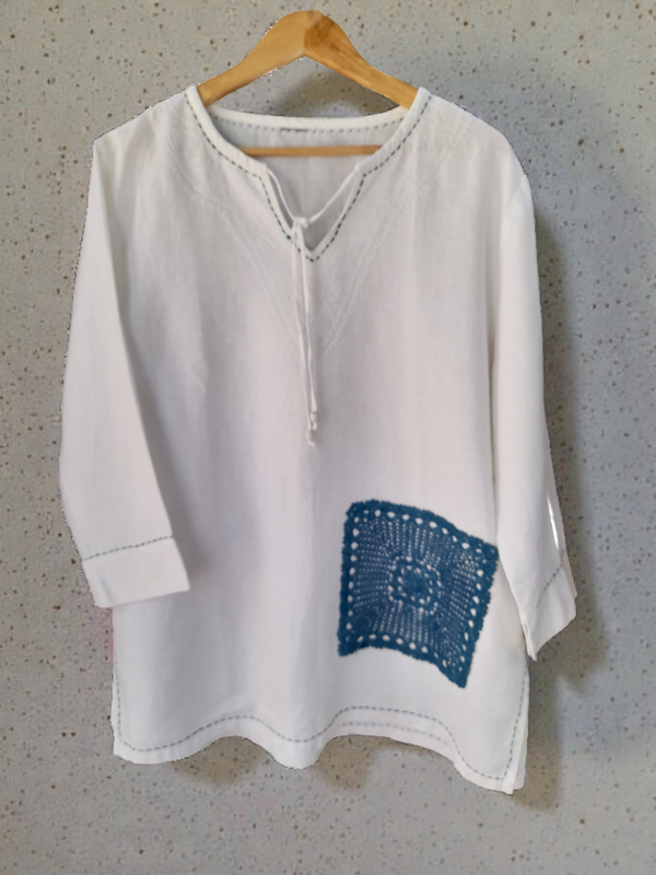 large v shapen linen tunic with indigo ornament