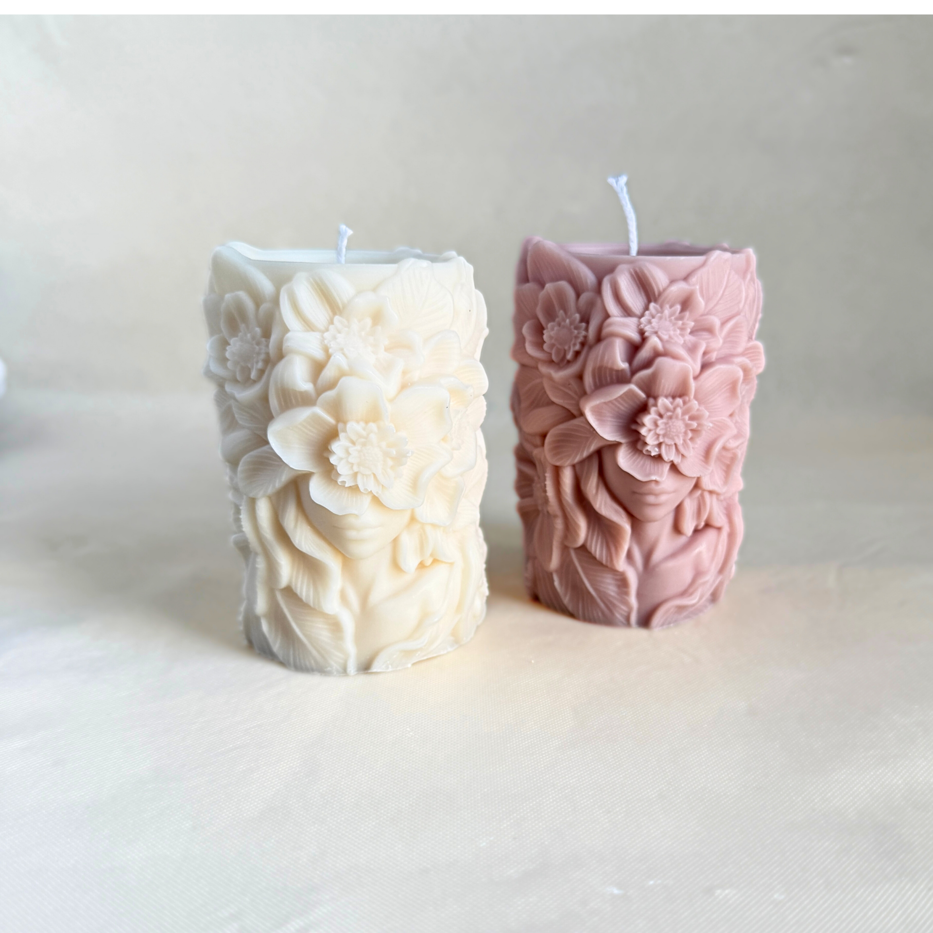 Decoratieve stompkaars met vrouwengezicht en bloemen