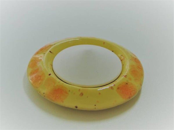 Geursteentje, geel oranje, glanzend