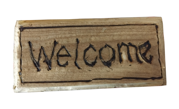 Puupoltettu “Welcome” -kyltti