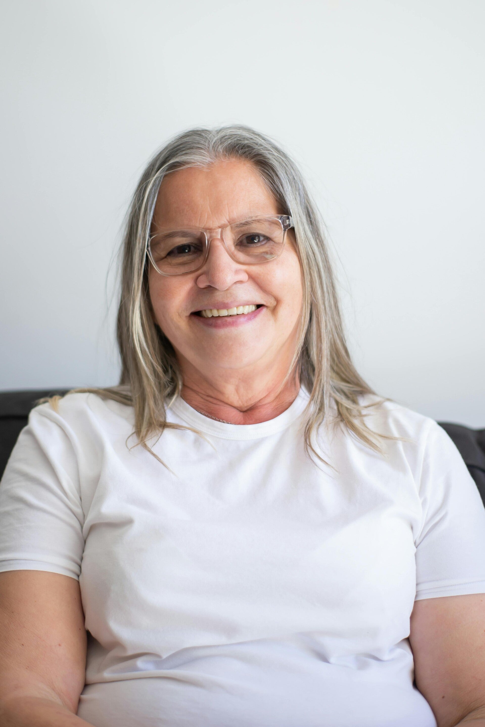 Eva G. from Tempe, Arizona, smiling after completing her estate plan with Claim My Legacy, showcasing the peace of mind that comes with a professional living trust.