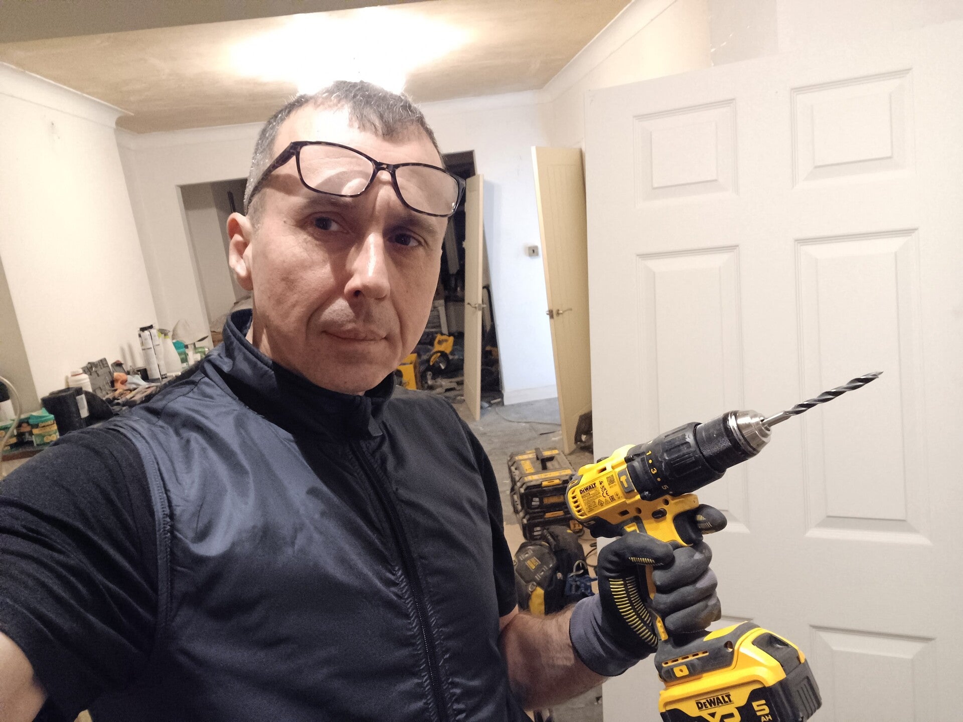 Ukrainian handyman painting living room walls in London