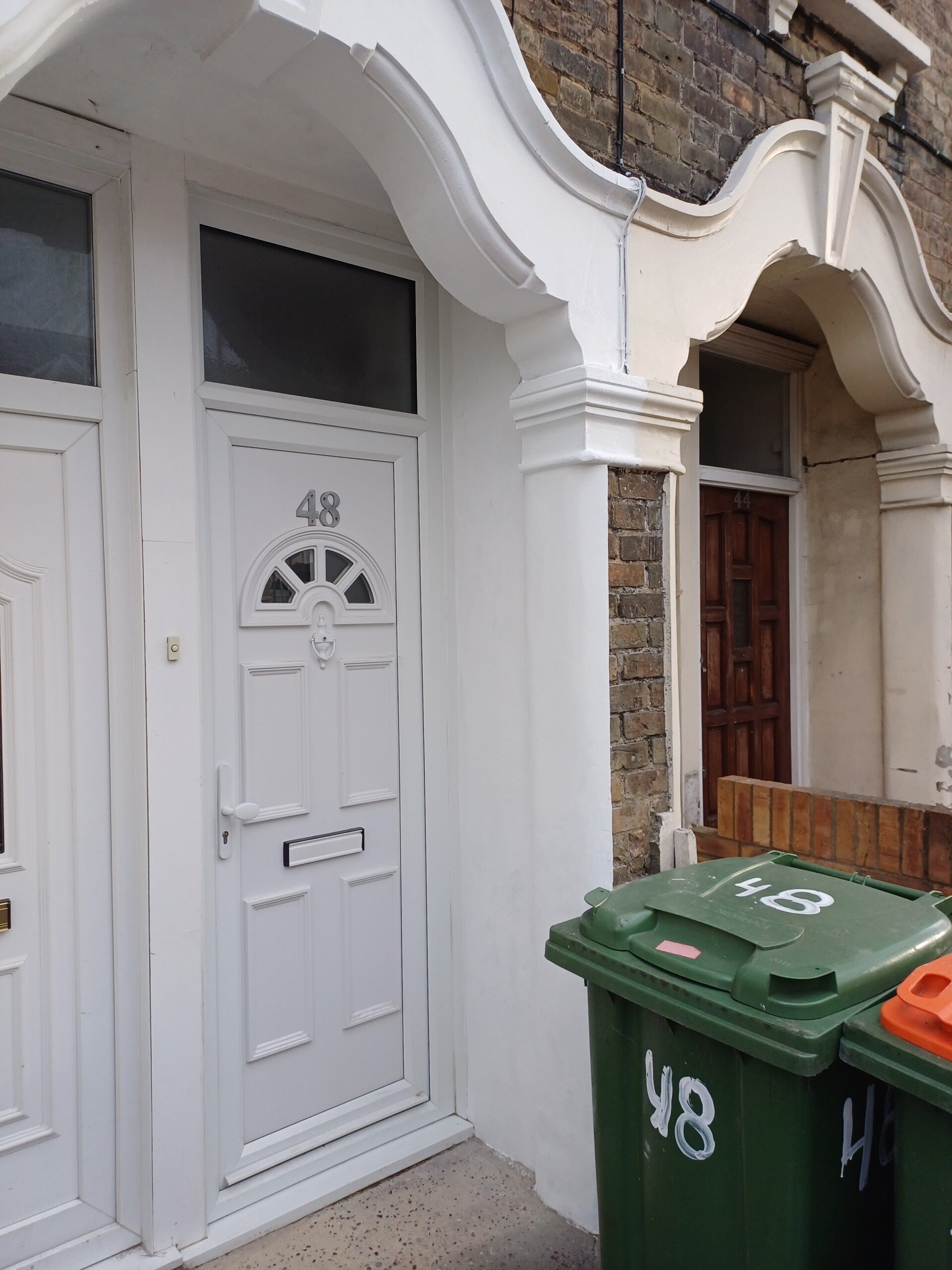 Ukrainian handyman painting living room walls in London