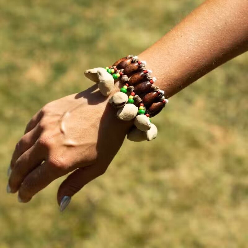 Kenari-Muschel-Handschüttler – Rasselarmband