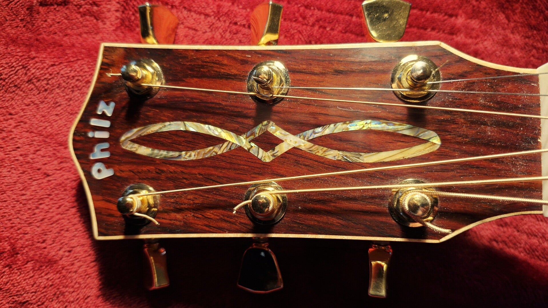 Curly maple edge banding to Brazilian rosewood faceplate with Philz MOP brand name and abalone decal