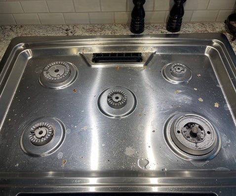 Before photo of dirty stovetop