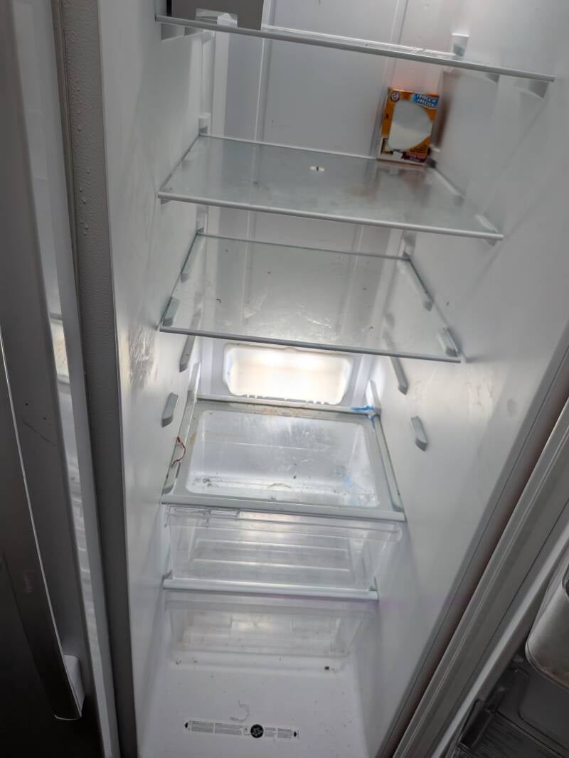 Before photo of dirty refrigerator