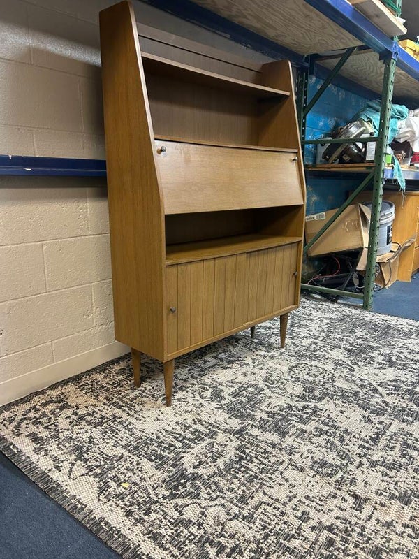 midcentury laminate bookshelf with sliding doors and drop down desk