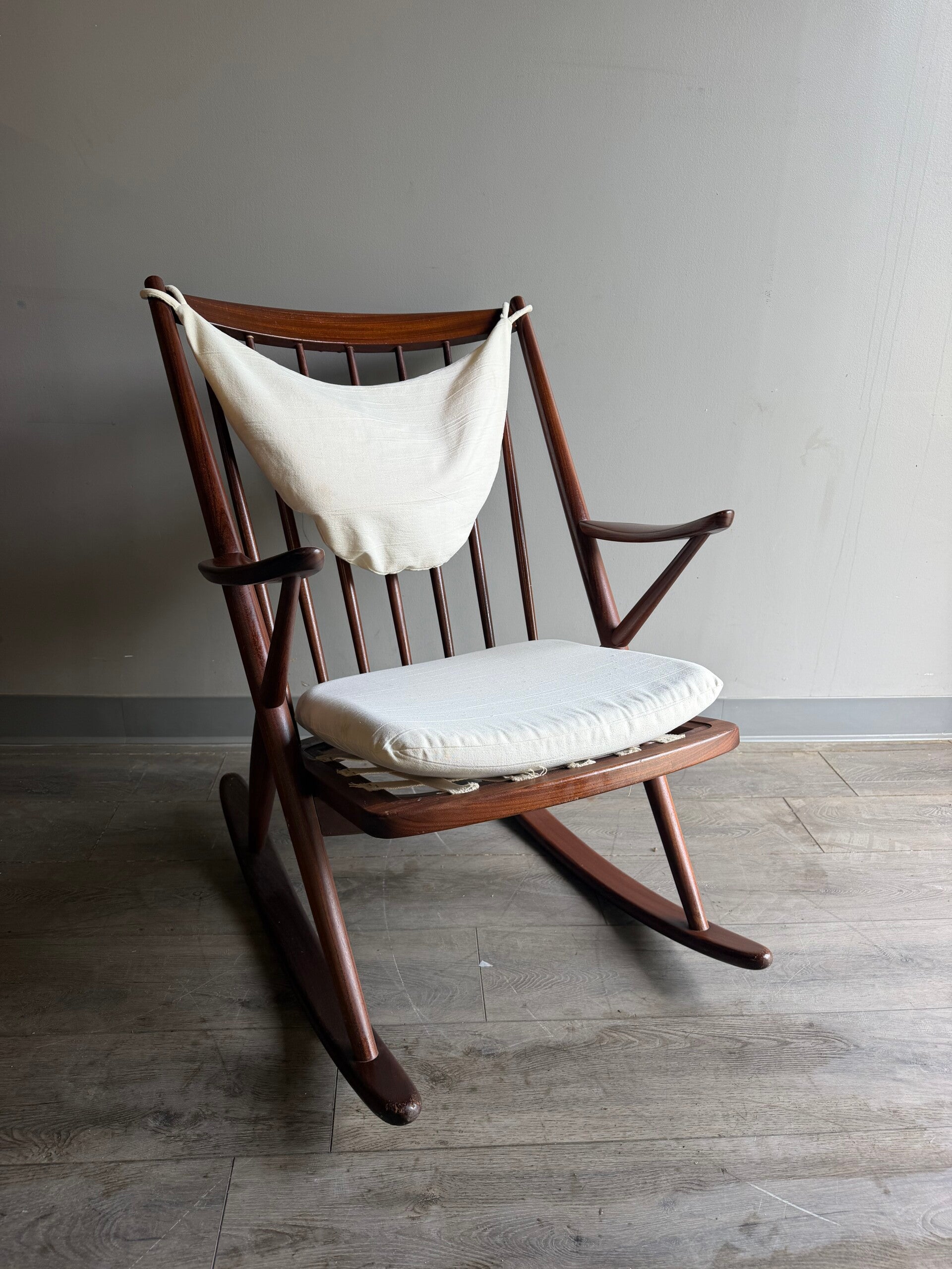 Danish Mcm rocking chair with cream cushions