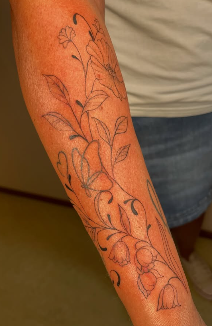 fineline flower sleeve tattoo