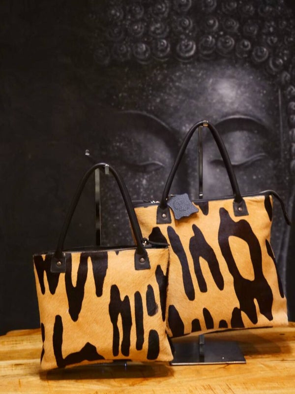 Shopper in leder en koehuid