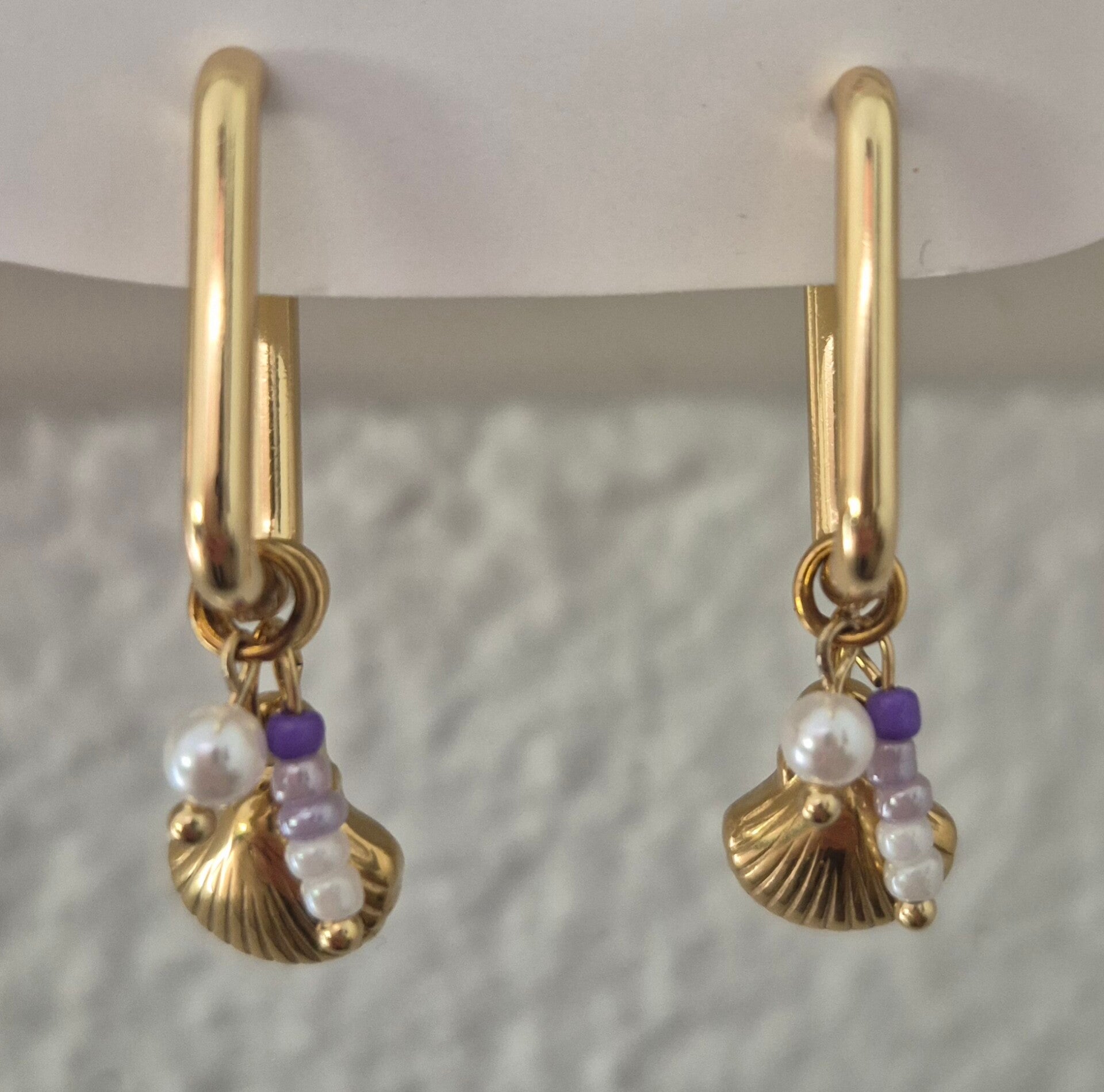 oorbel gouden schelp