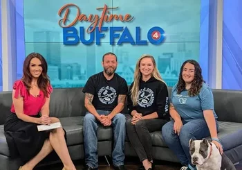 AAO team members on Daytime Buffalo with one of the dogs in their care.