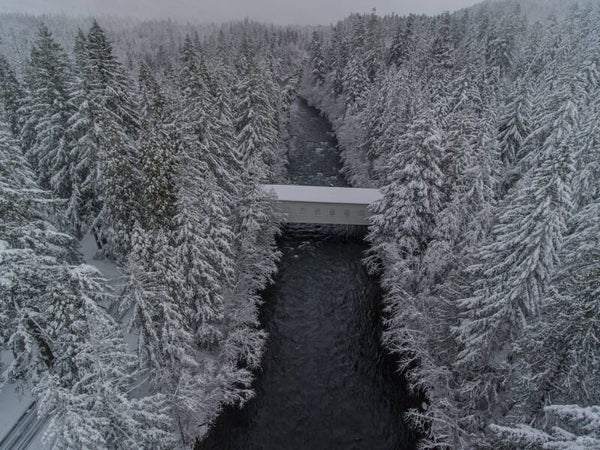 Snowy Belknap Covered Bridge:  The McKenzie River Metal Print