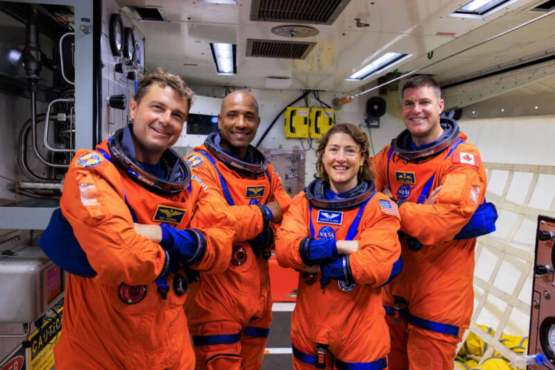 Artemis II NASA astronauts (left to right) Reid Wiseman, Victor Glover, and Christina Koch, and CSA (Canadian Space Agency) astronaut Jeremy Hansen stand in the white room on the crew access arm of the mobile launcher at Launch Pad 39B as part of an integ