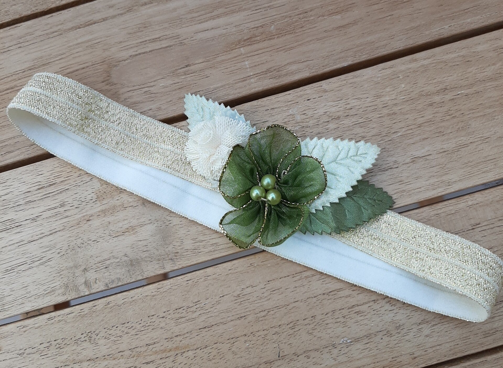 haarbandje goud/groene bloem